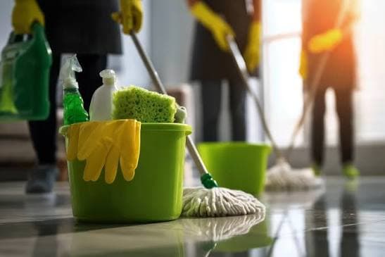 Mop, bucket, and cleaning products ready for floor care